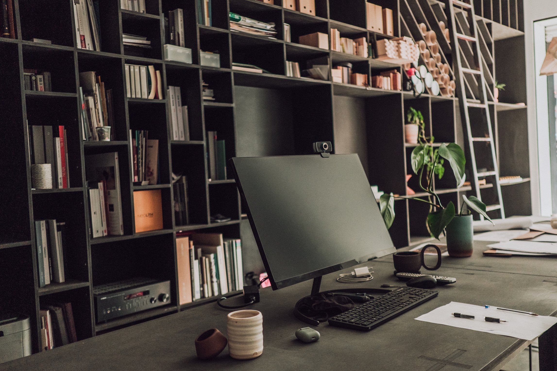 Black Furniture with Computer on Table in Studio