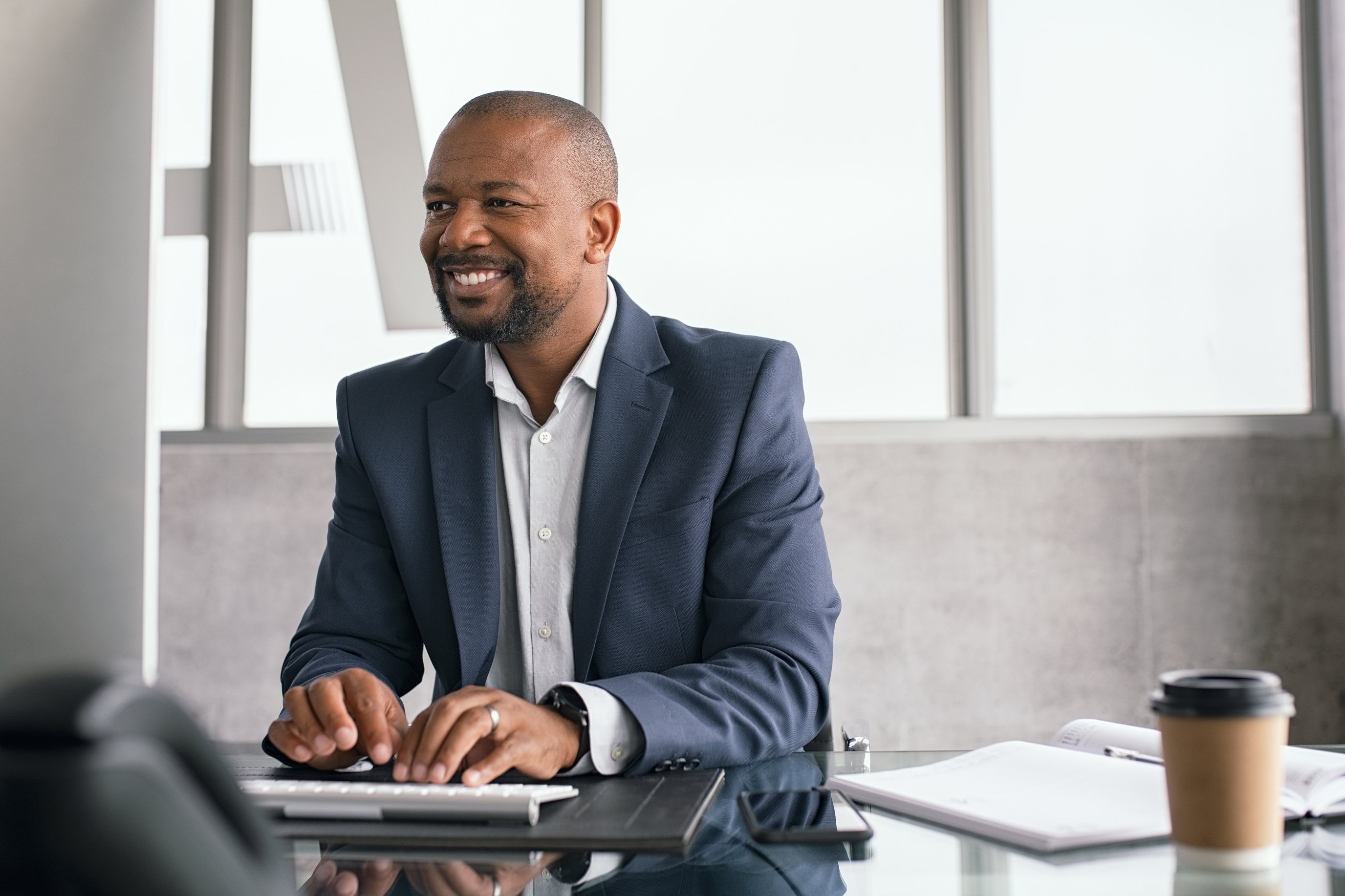 Happy Businessman Working on Computer